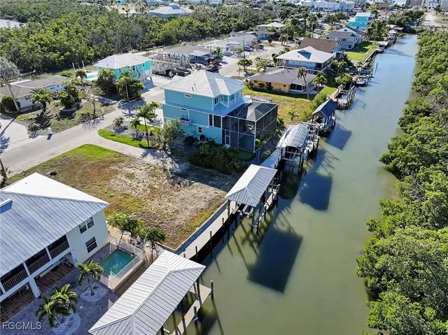 an aerial view of a house with outdoor space