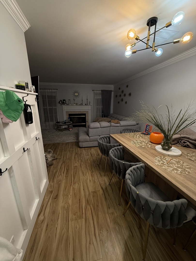 1063 Stillwater Road, Unit 1063 Elgin, IL 60120 - Photo 14 of 17 a kitchen with stainless steel appliances granite countertop a stove a sink dishwasher and cabinets with wooden floor
