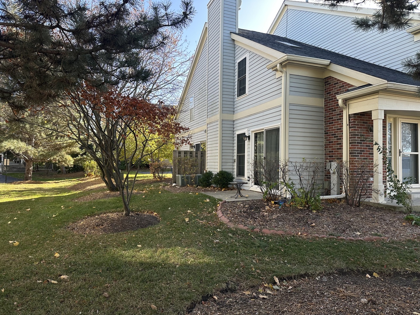 1063 Stillwater Road, Unit 1063 Elgin, IL 60120 - Photo 16 of 17 a view of a house with a yard