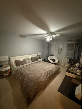 a bedroom with a bed and a dresser