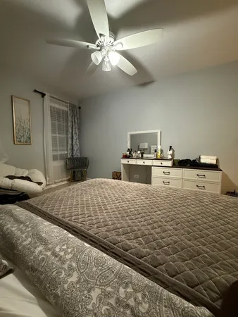 a large white bed in a white room