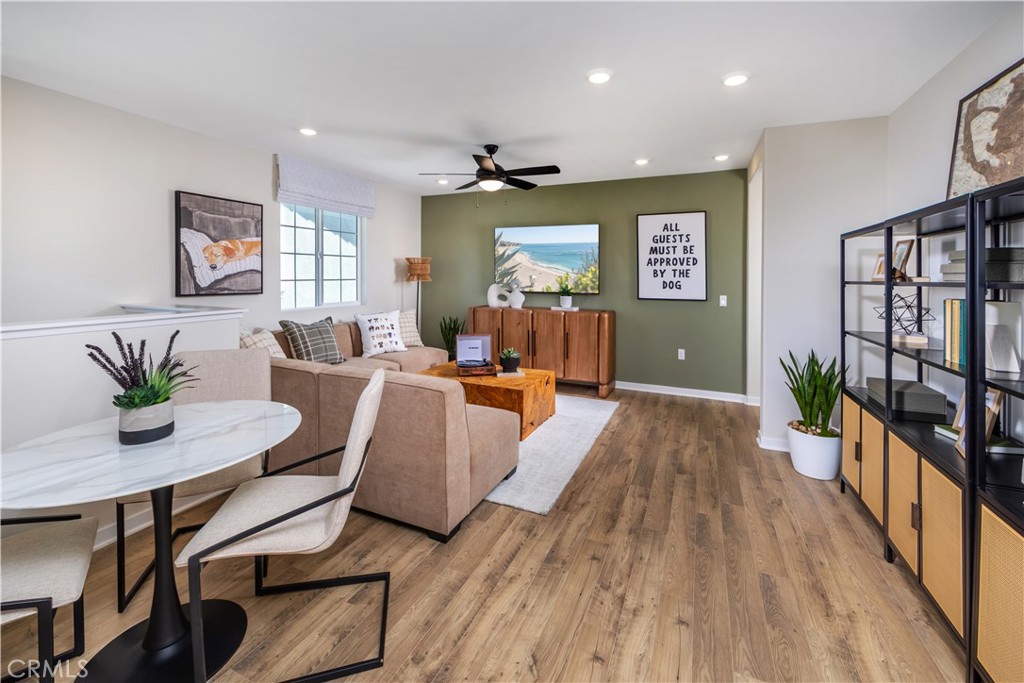 9568 Glenmore Frst Drive Riverside, CA 92508 - Photo 10 of 12 a living room with furniture and a wooden floor
