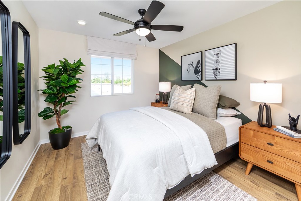 9568 Glenmore Frst Drive Riverside, CA 92508 - Photo 8 of 12 a bedroom with bed and a potted plant