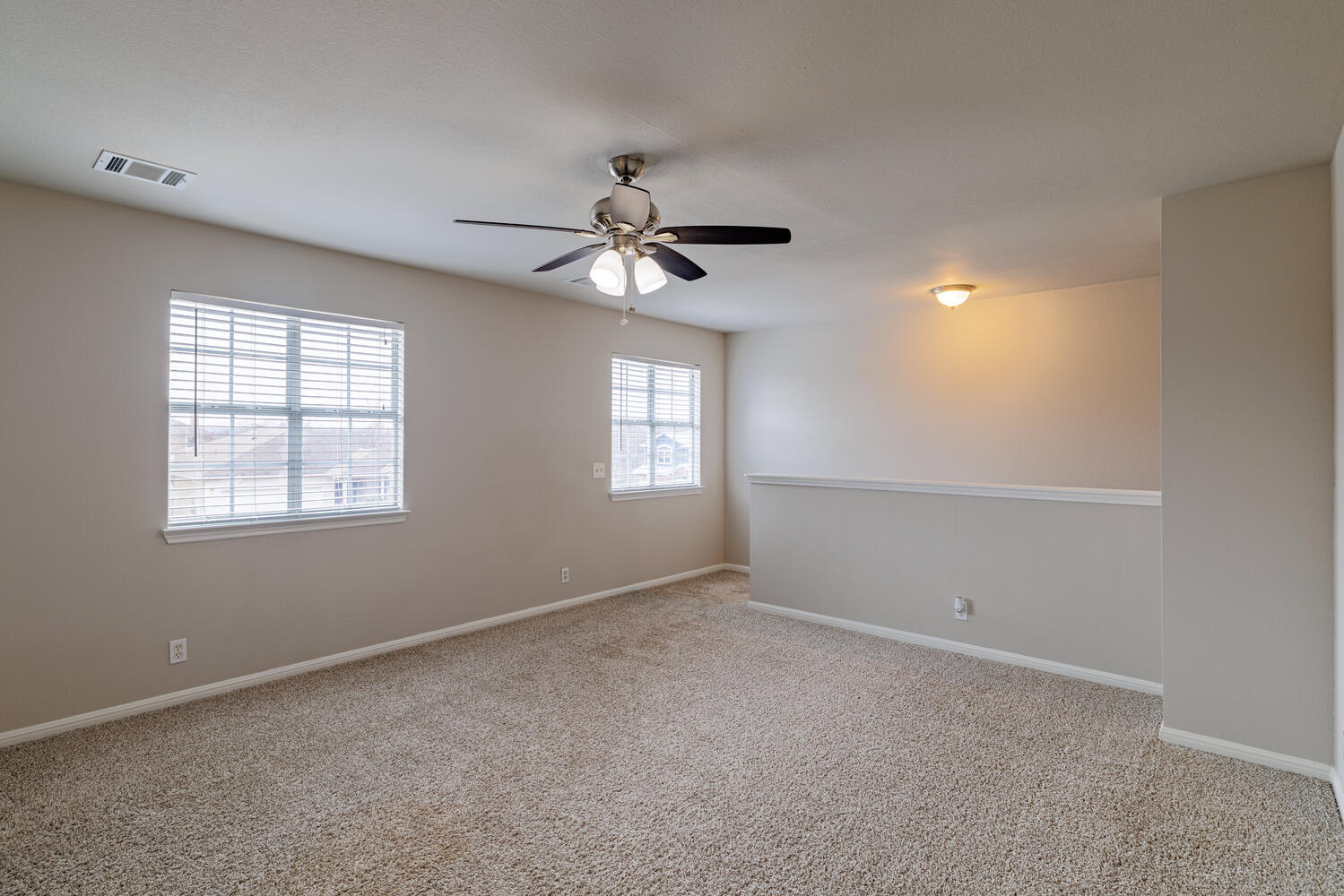 11402 Marshall Street Manor, TX 78653 - Photo 16 of 34 Spare room with light carpet and ceiling fan