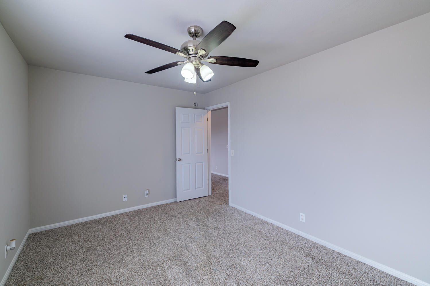 11402 Marshall Street Manor, TX 78653 - Photo 19 of 34 Carpeted spare room featuring baseboards and a ceiling fan