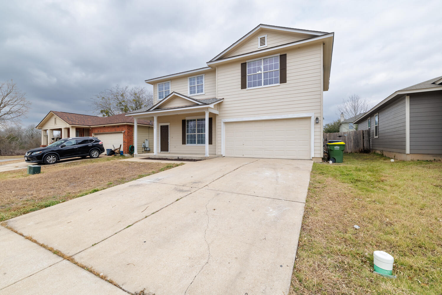 11402 Marshall Street Manor, TX 78653 - Photo 2 of 34 Traditional home featuring a porch, a garage, and driveway