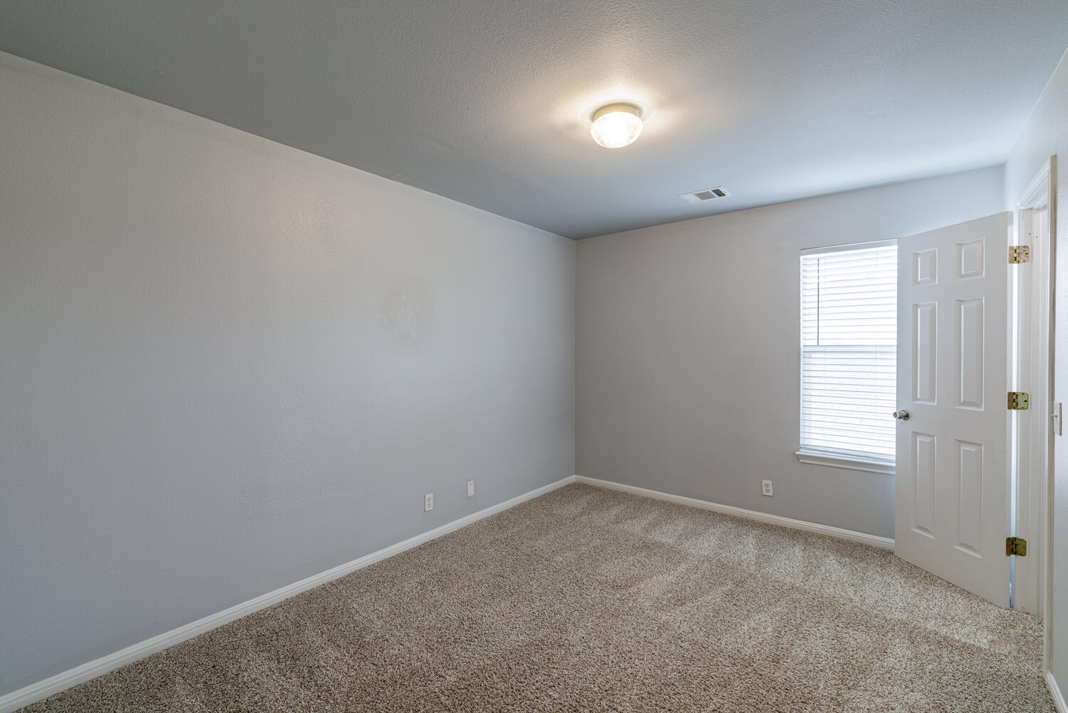11402 Marshall Street Manor, TX 78653 - Photo 20 of 34 Carpeted empty room featuring baseboards