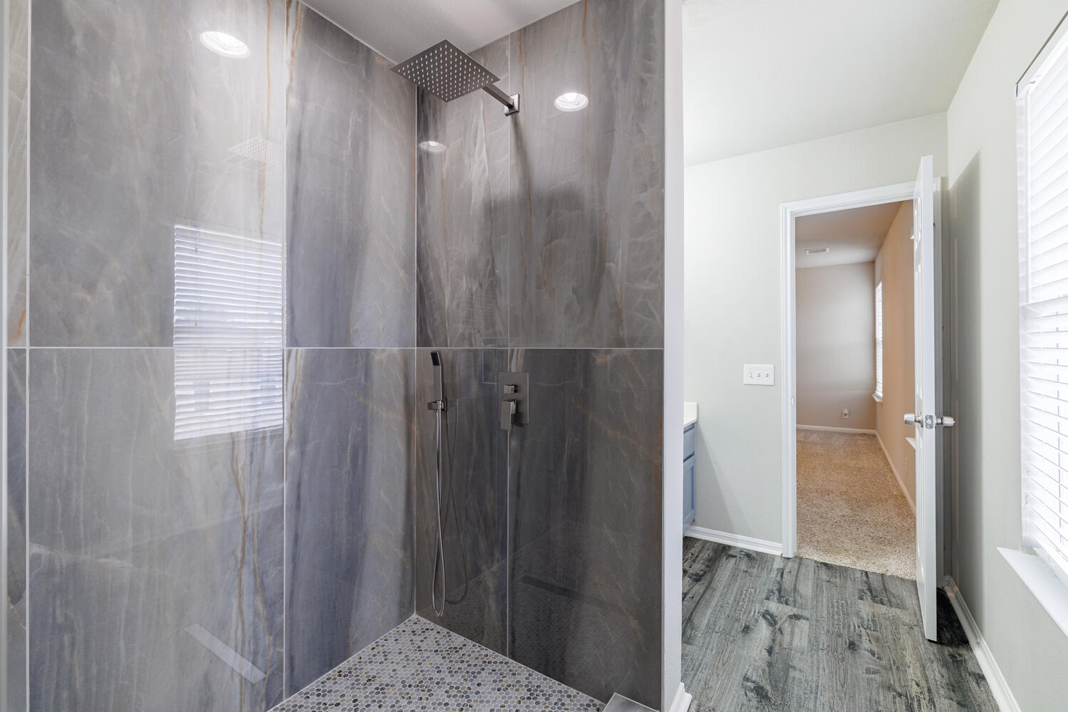 11402 Marshall Street Manor, TX 78653 - Photo 28 of 34 Full bath with a marble finish shower, vanity, and wood finished floors