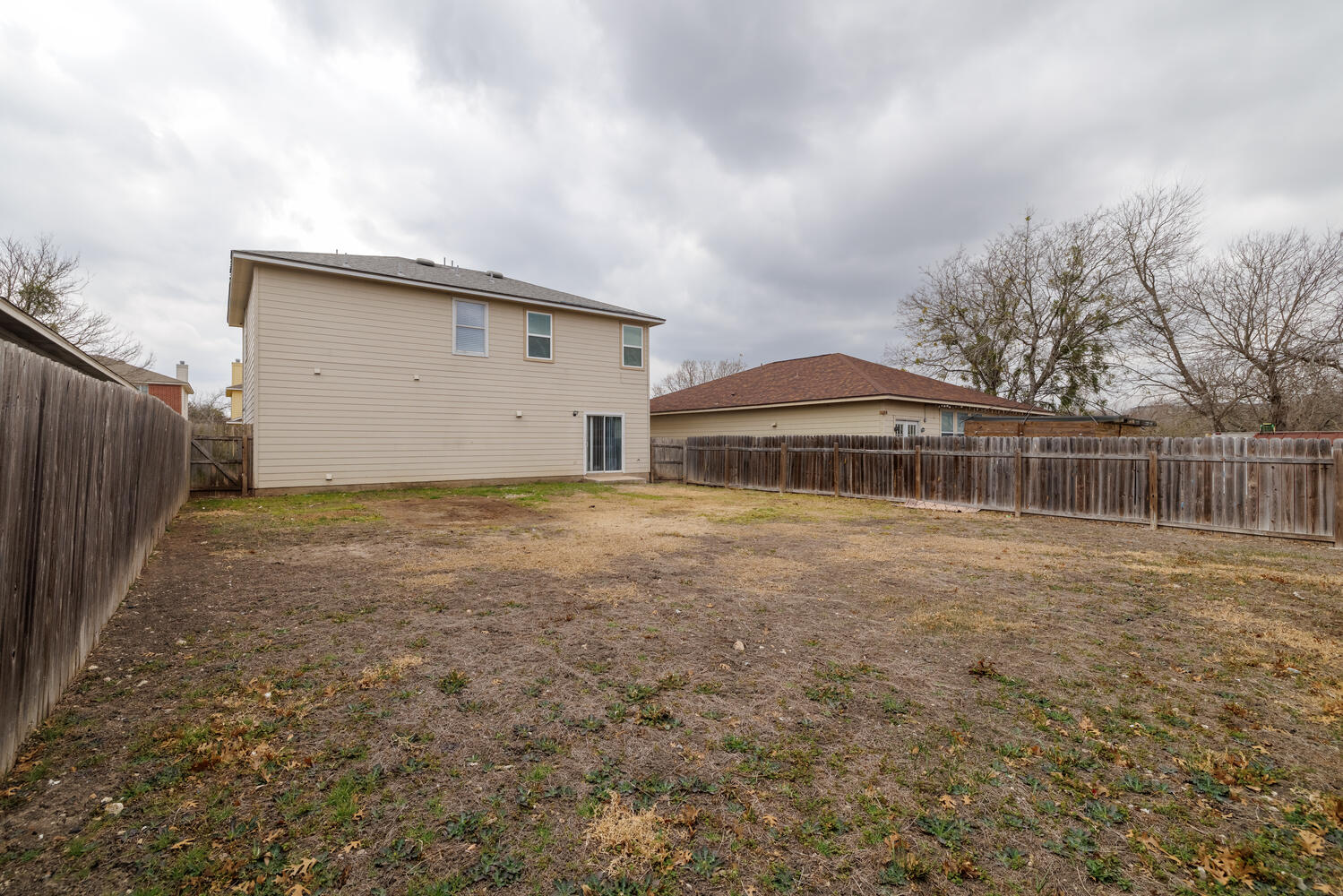 11402 Marshall Street Manor, TX 78653 - Photo 32 of 34 Back of house with a fenced backyard