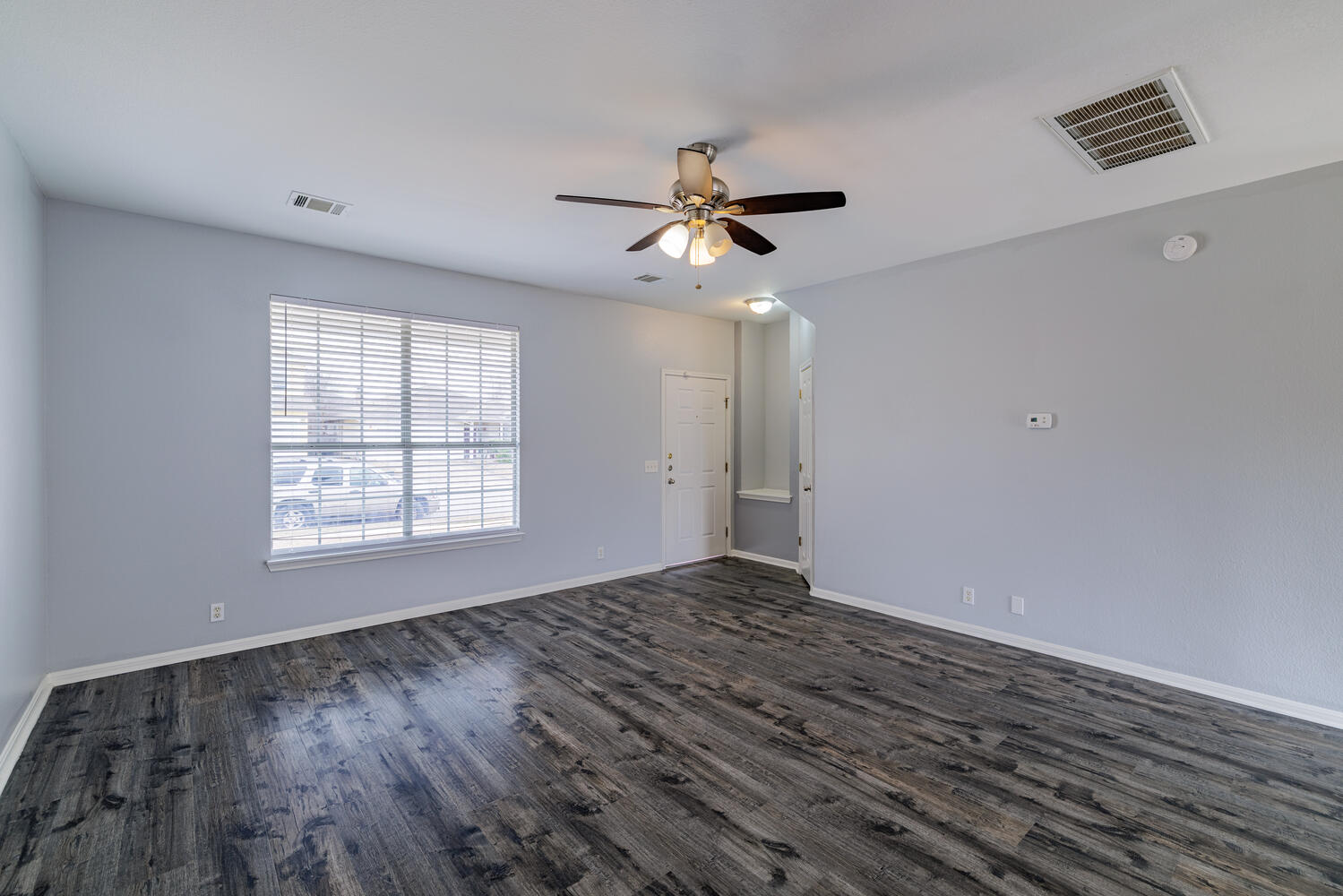 11402 Marshall Street Manor, TX 78653 - Photo 6 of 34 Unfurnished room featuring dark wood finished floors and ceiling fan