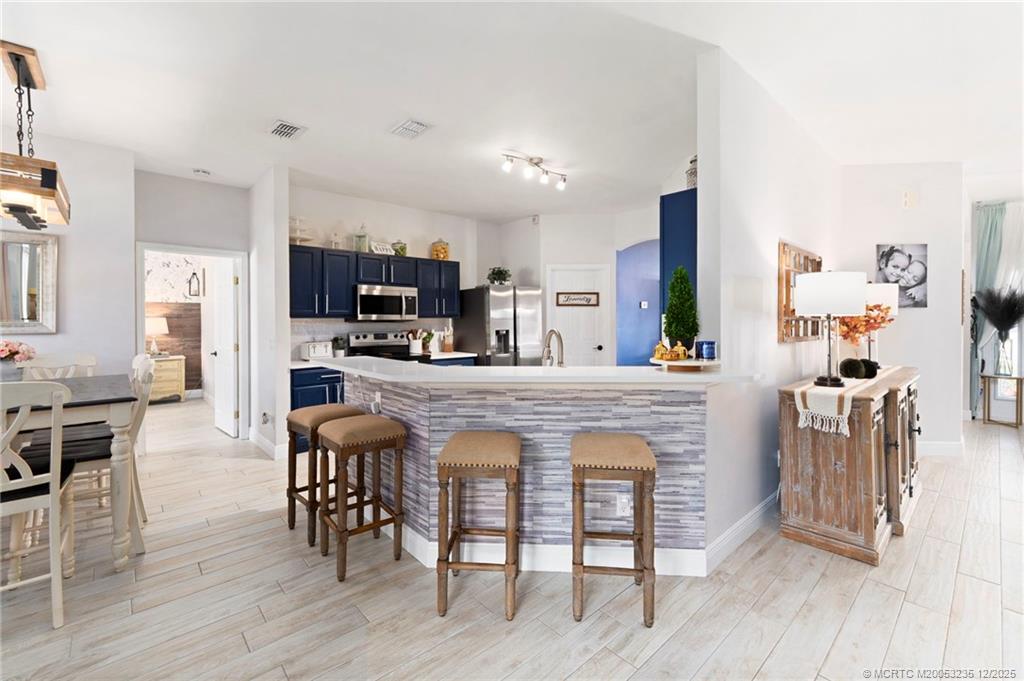 801 Southwest Tulip Boulevard Port St. Lucie, FL 34953 - Photo 19 of 41 a view of kitchen dining table and chairs