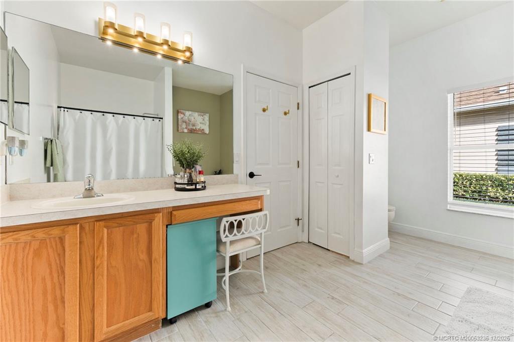 801 Southwest Tulip Boulevard Port St. Lucie, FL 34953 - Photo 29 of 41 a bathroom with a sink double vanity and a mirror