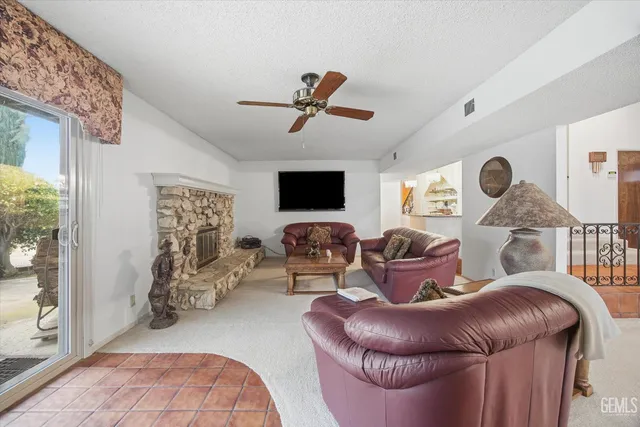 a kitchen with granite countertop stainless steel appliances and a counter top space