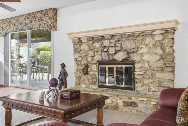 a kitchen with stainless steel appliances kitchen island granite countertop a refrigerator and cabinets