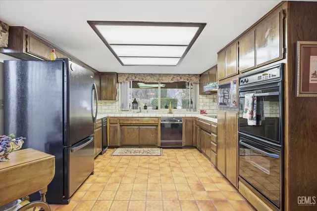 a large bedroom with a bed and a flat screen tv