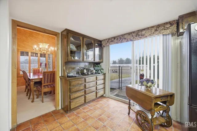 a view of a swimming pool with a patio and lake view