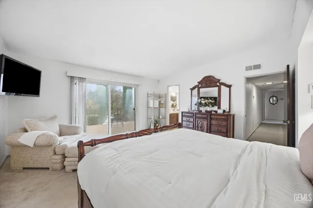 a view of a patio with table and chairs