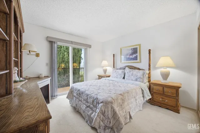 an aerial view of a house with garden space and street view