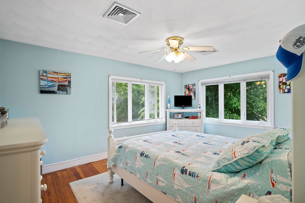 19 Belcher Street Winthrop, MA 02152 - Photo 20 of 33 a bedroom with a bed and a large window