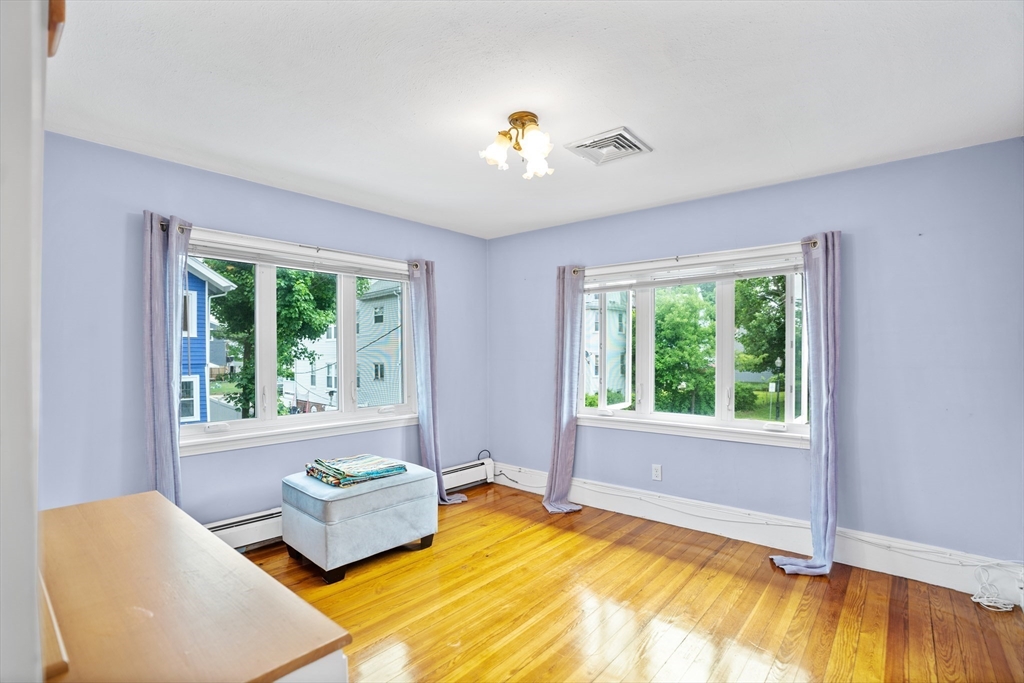 19 Belcher Street Winthrop, MA 02152 - Photo 23 of 33 a bedroom with a bed and a window