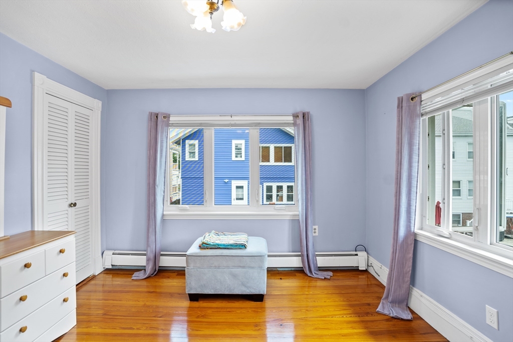 19 Belcher Street Winthrop, MA 02152 - Photo 24 of 33 a living room with furniture and a window