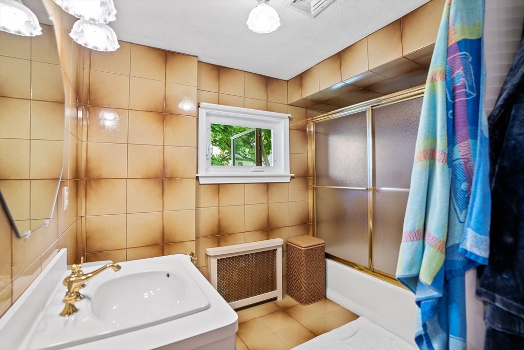 19 Belcher Street Winthrop, MA 02152 - Photo 26 of 33 a bathroom with a sink toilet and shower