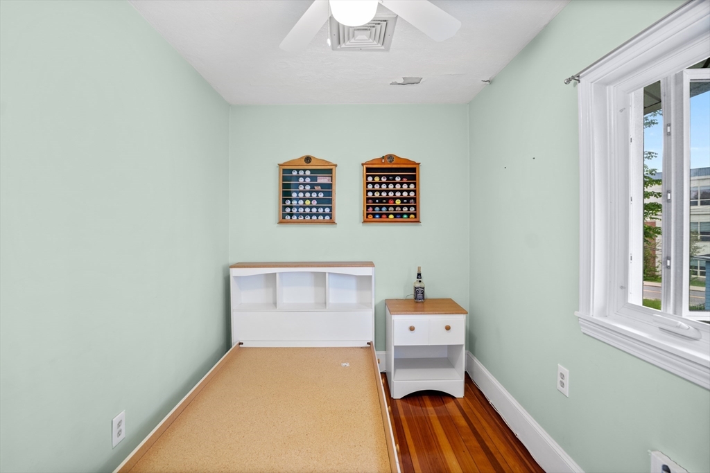 19 Belcher Street Winthrop, MA 02152 - Photo 30 of 33 a bedroom with a bed and a window
