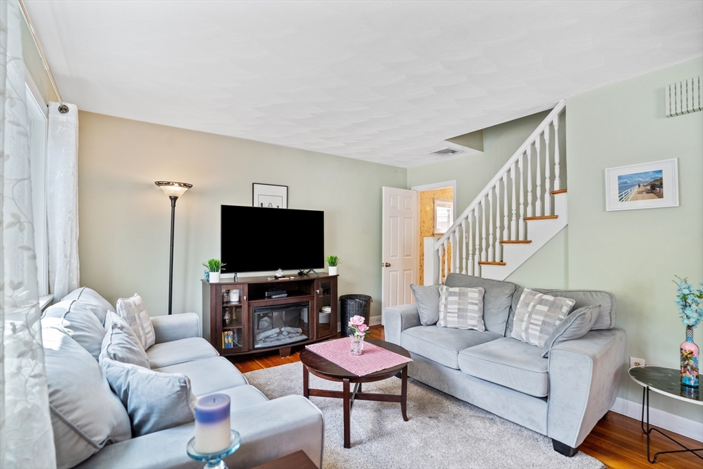 19 Belcher Street Winthrop, MA 02152 - Photo 4 of 33 a living room with furniture and a flat screen tv