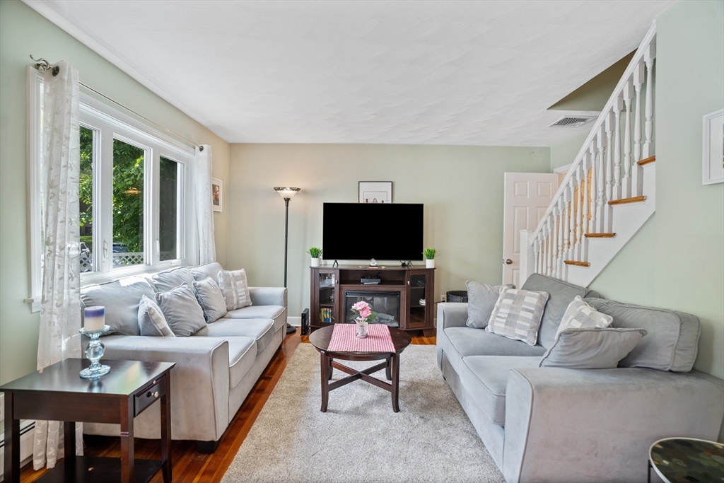 19 Belcher Street Winthrop, MA 02152 - Photo 5 of 33 a living room with furniture and a flat screen tv
