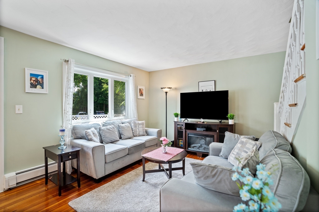 19 Belcher Street Winthrop, MA 02152 - Photo 7 of 33 a living room with furniture and a flat screen tv