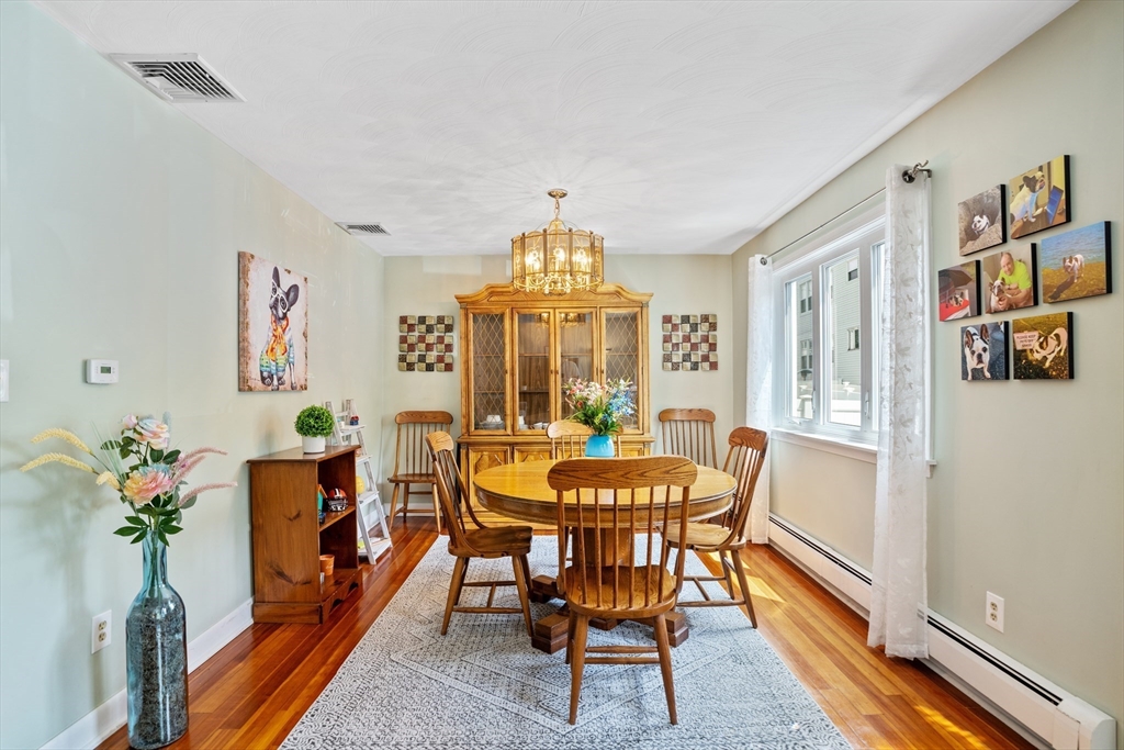 19 Belcher Street Winthrop, MA 02152 - Photo 8 of 33 a view of a dining room with furniture window and wooden floor