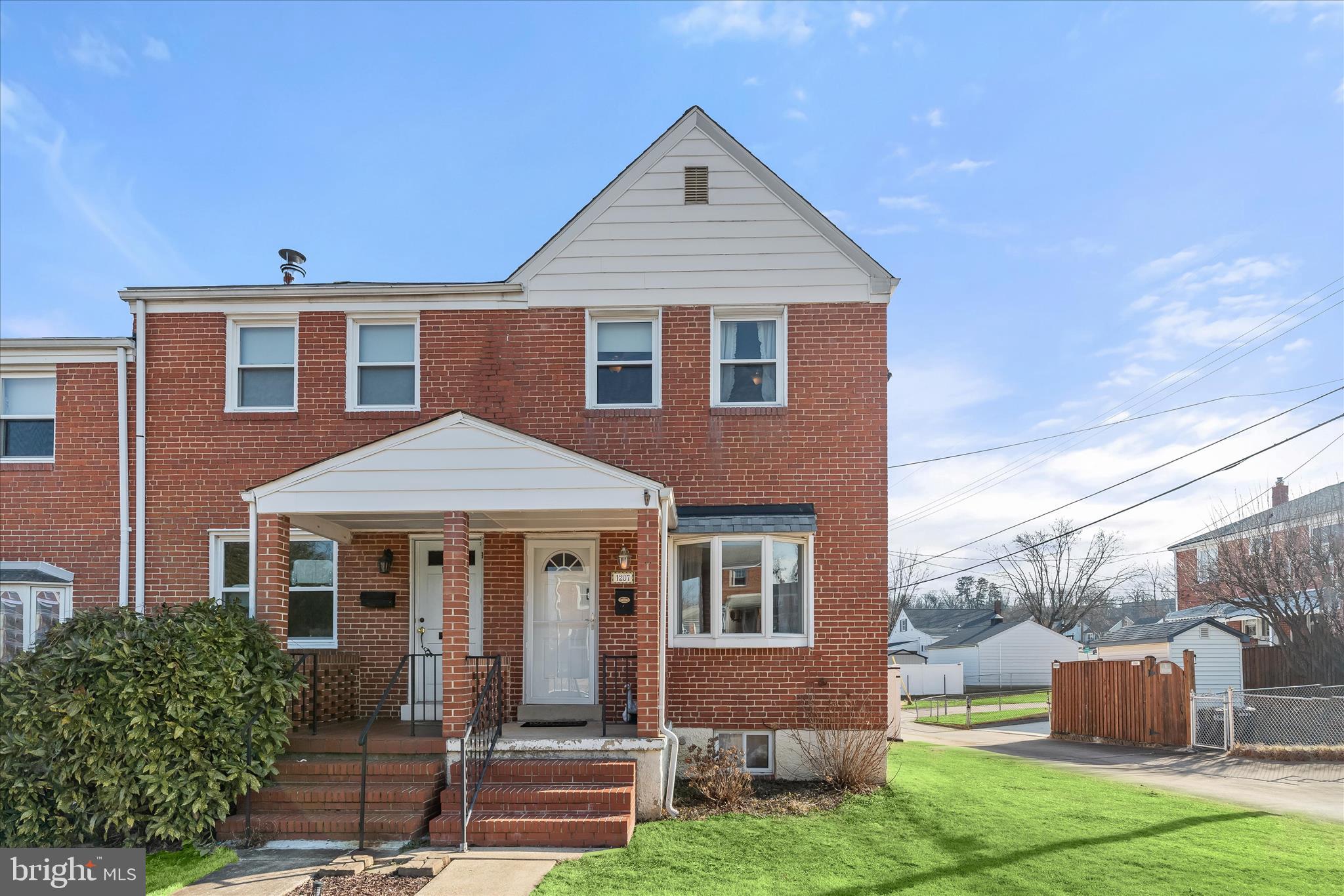 1207 Brewster Street Halethorpe, MD 21227 - Photo 1 of 34 a front view of a house with garden