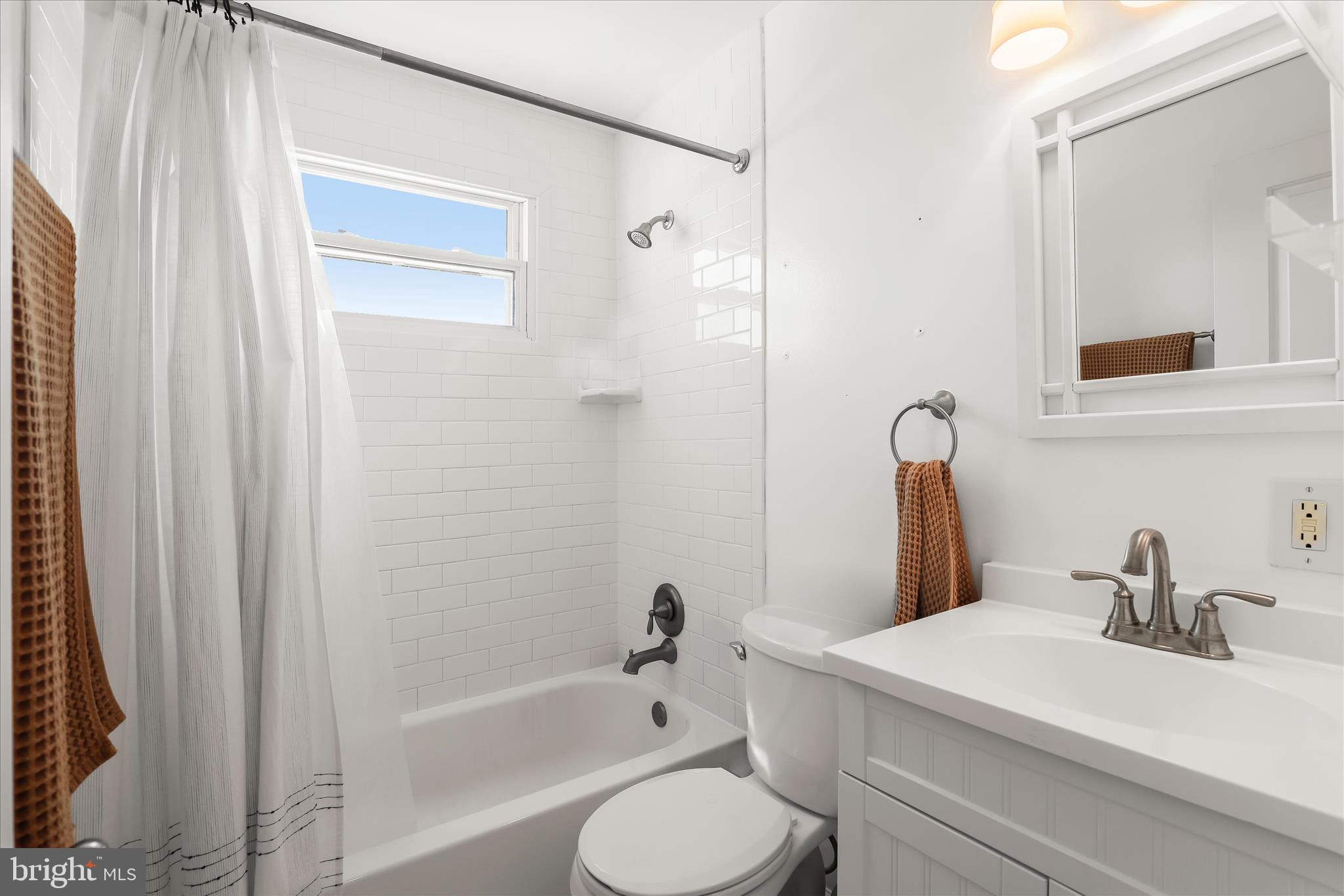 1207 Brewster Street Halethorpe, MD 21227 - Photo 22 of 34 a bathroom with a sink a toilet and shower