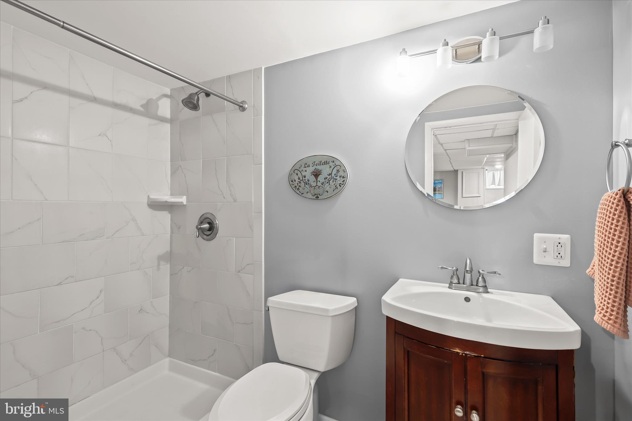 1207 Brewster Street Halethorpe, MD 21227 - Photo 27 of 34 a bathroom with a toilet sink and mirror