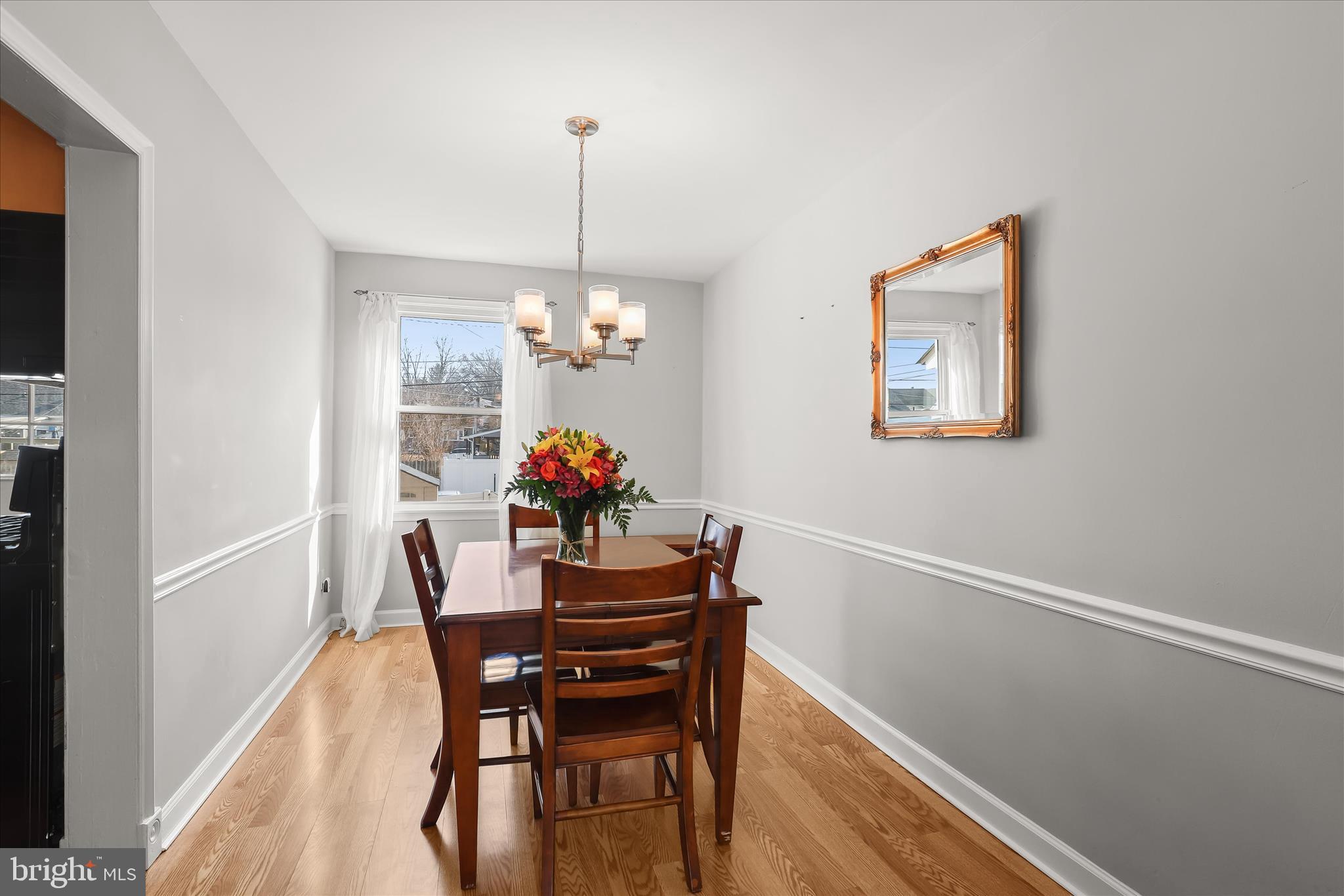 1207 Brewster Street Halethorpe, MD 21227 - Photo 8 of 34 a view of a dining room with furniture and wooden floor