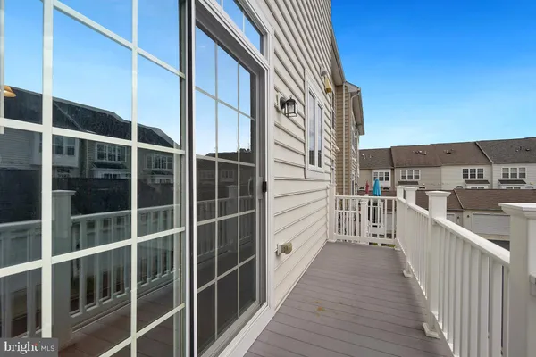 a view of a balcony with wooden floor