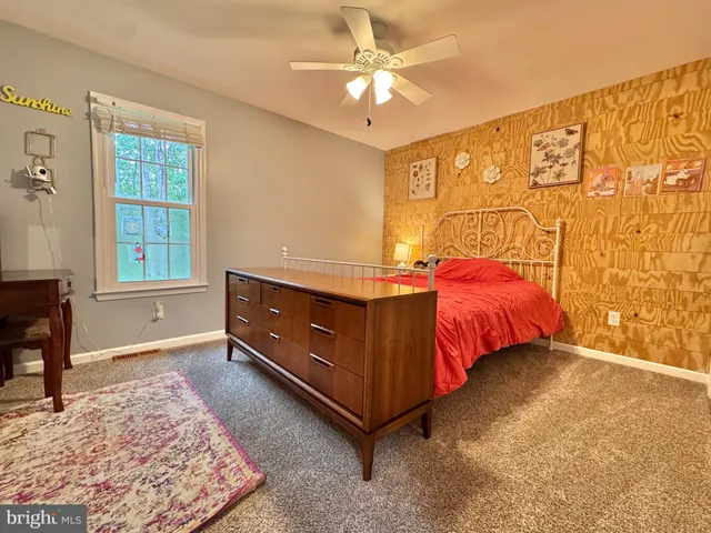 a bedroom with furniture and windows