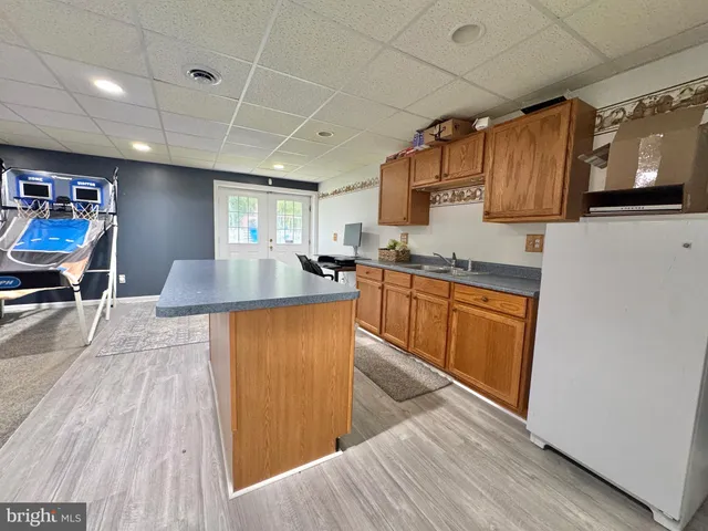 a living room with furniture a flat screen tv and a table