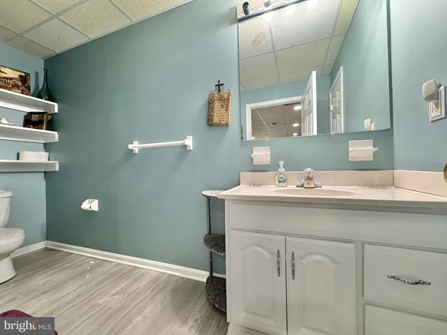 a kitchen with stainless steel appliances granite countertop a sink a stove counter space and a window