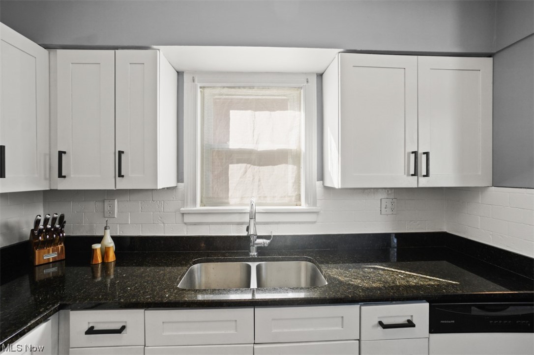 3631 Bainbridge Road Cleveland Heights, OH 44118 - Photo 8 of 20 Kitchen with stainless steel appliances, white cabinetry, and dark tile floors