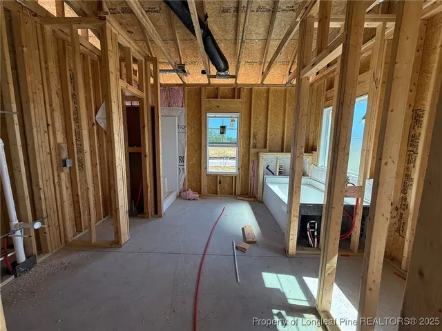 a bathroom with a bathtub and shower