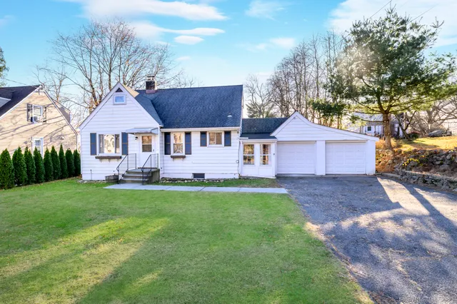 a front view of a house with yard
