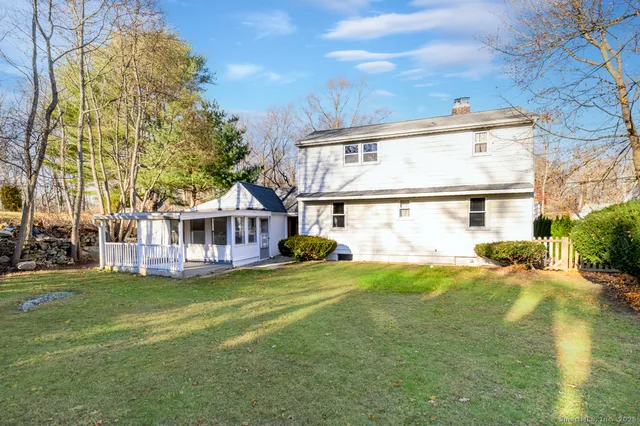 a view of yard with swimming pool and sitting area