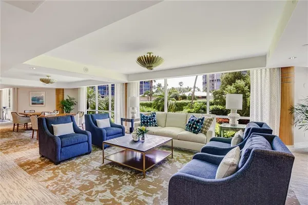 a view of a dining room with furniture and a wooden floor