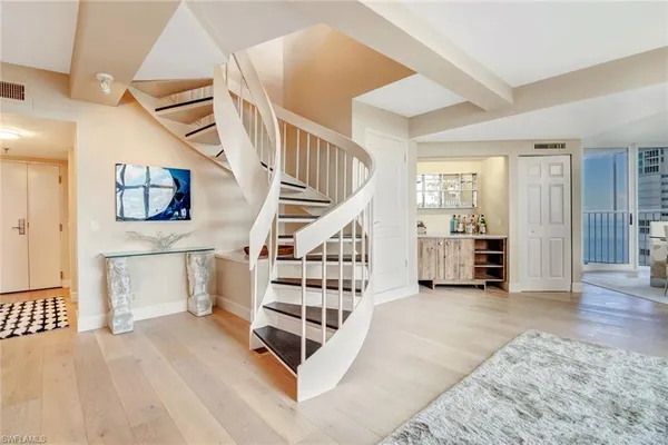 a kitchen with stainless steel appliances granite countertop a stove sink and refrigerator