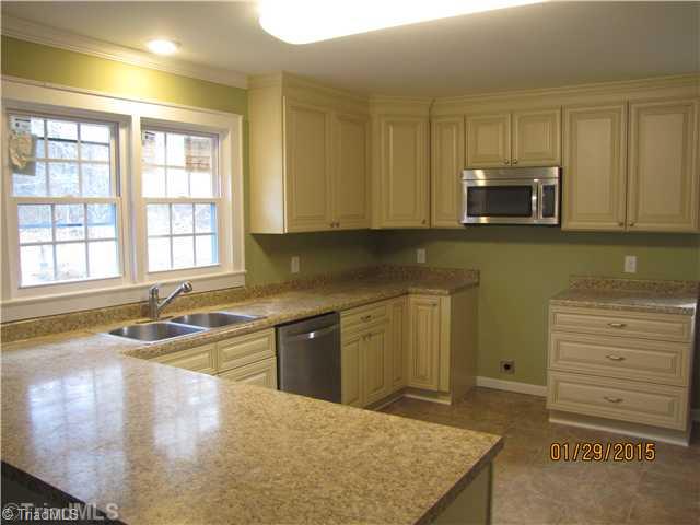 2000 Pope Road Winston-Salem, NC 27127 - Photo 2 of 14 Kitchen. New Kitchen: custom all wood cabinets with soft close drawers. Smooth counters and eat-at bar counter.
