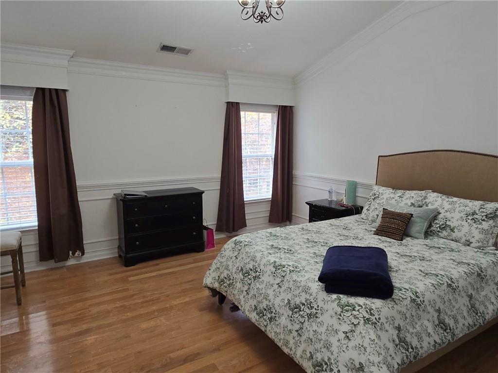 2900 Suttles Drive Southwest Atlanta, GA 30331 - Photo 13 of 23 a bedroom with a large bed and a fireplace