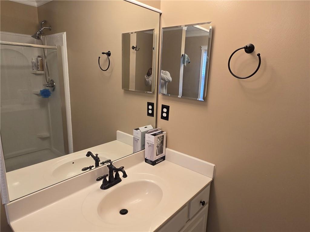 2900 Suttles Drive Southwest Atlanta, GA 30331 - Photo 16 of 23 a bathroom with a sink vanity and a mirror