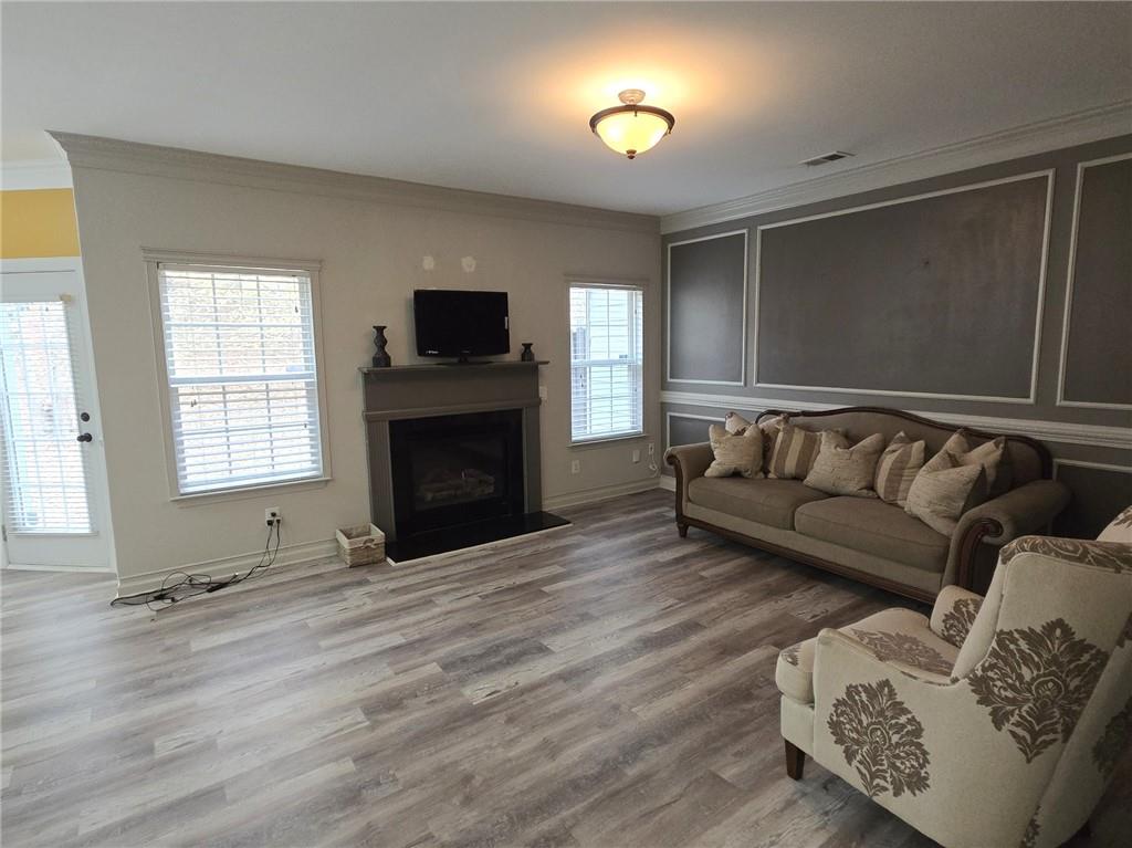 2900 Suttles Drive Southwest Atlanta, GA 30331 - Photo 6 of 23 a living room with furniture and a flat screen tv