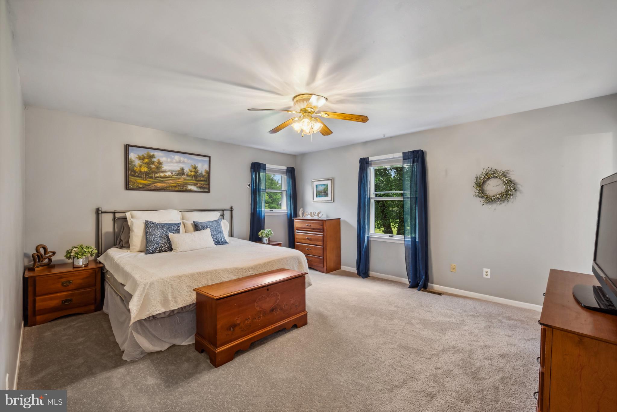 3825 Salem Bottom Road Westminster, MD 21157 - Photo 11 of 43 a bedroom with a bed and a chandelier